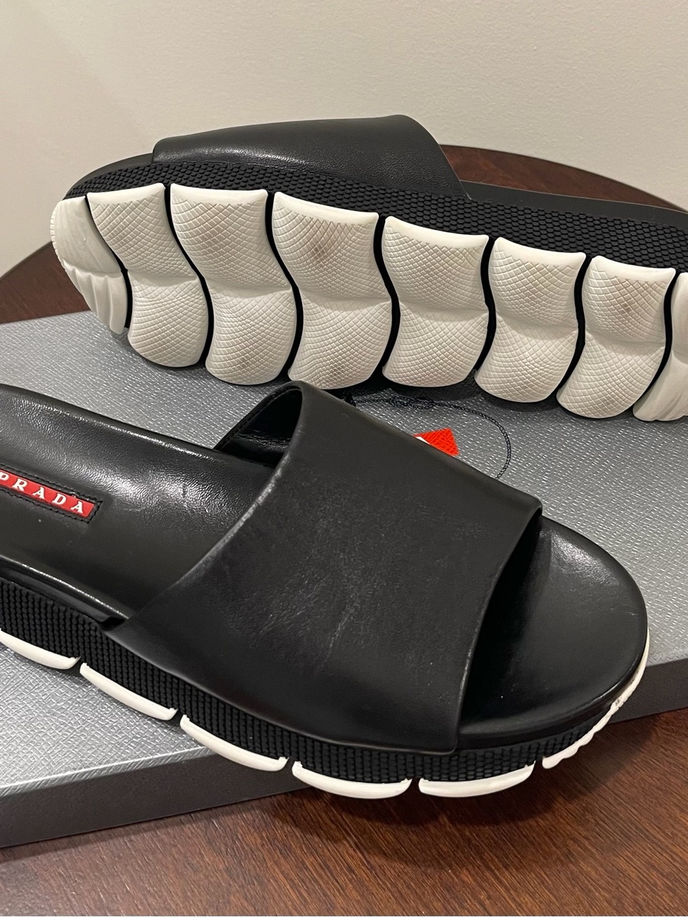 Prada Black Leather Slide Sandals with White Segmented Sole